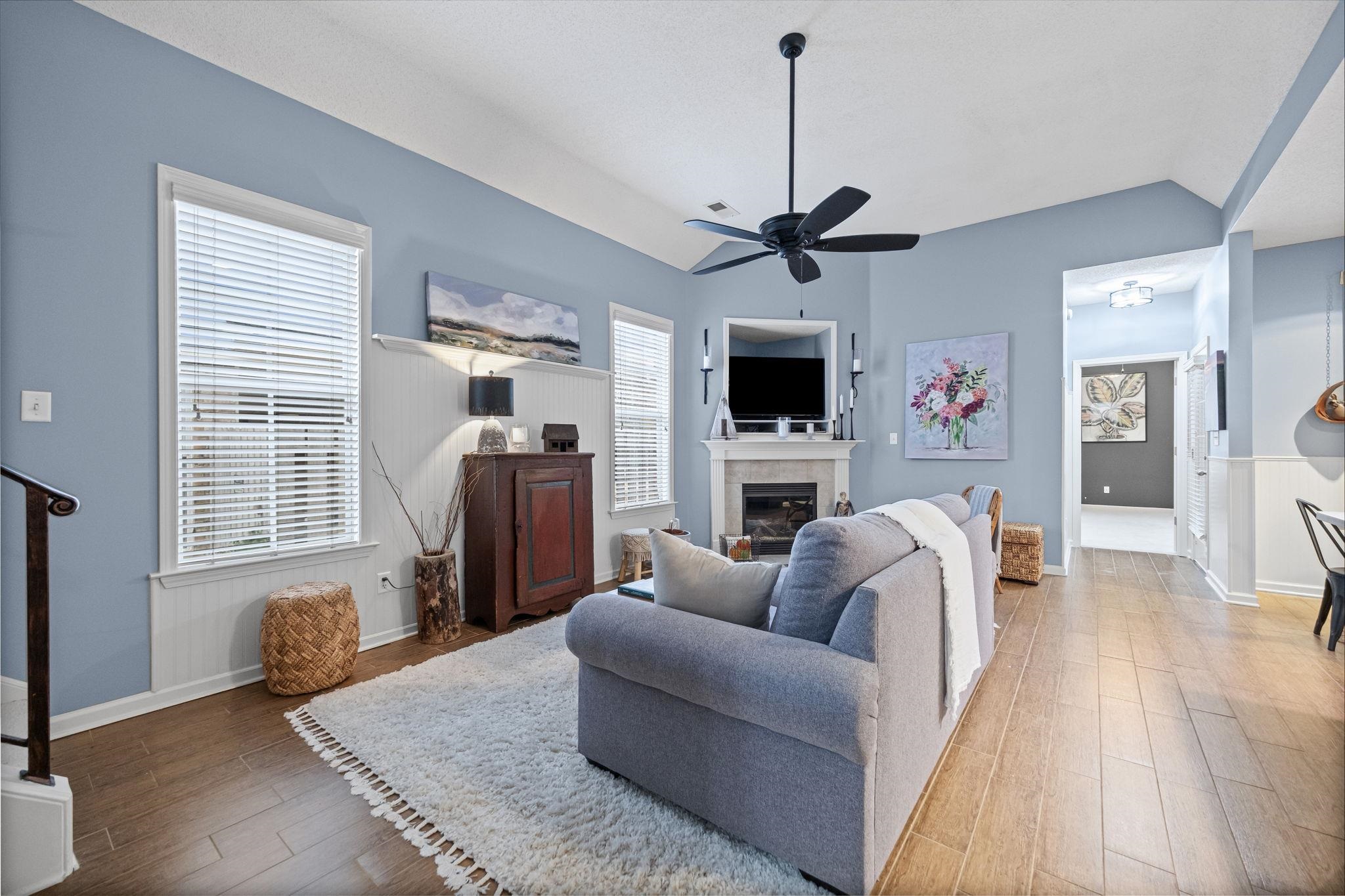4950 Shaws Ridge Trail Arlington, TN 38002 - Photo 9 of 27 a living room with furniture a flat screen tv and a fireplace