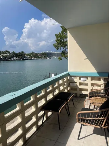 a terrace with outdoor seating and city view