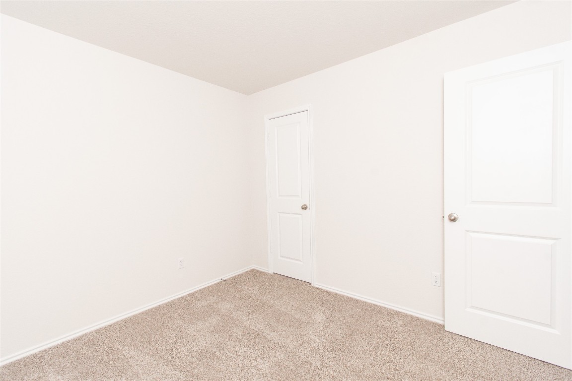 201 Varner Way Lockhart, TX 78644 - Photo 10 of 16 Carpeted empty room with baseboards