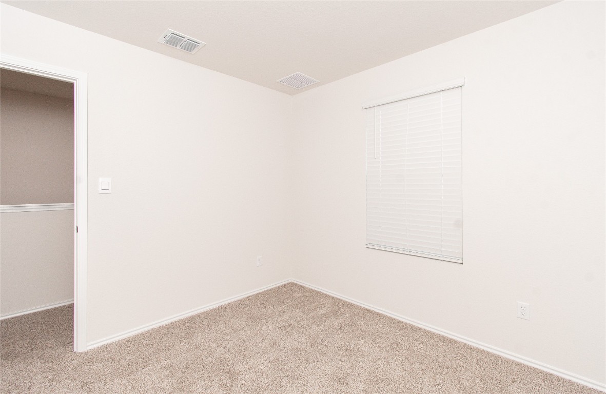 201 Varner Way Lockhart, TX 78644 - Photo 11 of 16 Carpeted spare room with baseboards