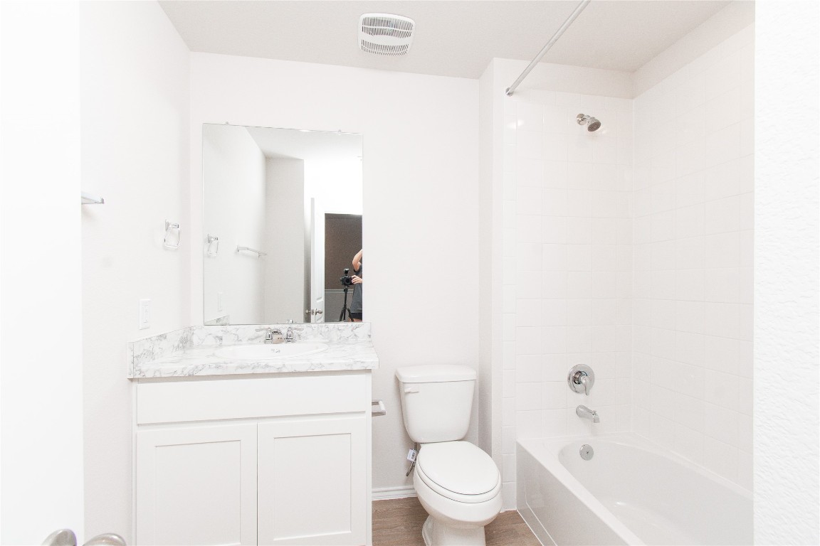 201 Varner Way Lockhart, TX 78644 - Photo 13 of 16 Full bathroom with shower / bath combination, vanity, and light wood-type flooring