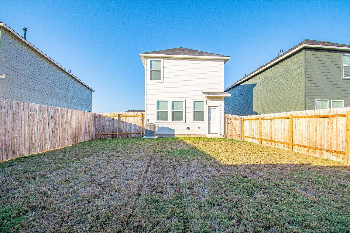 201 Varner Way Lockhart, TX 78644 - Photo 14 of 16 Rear view of property with a fenced backyard
