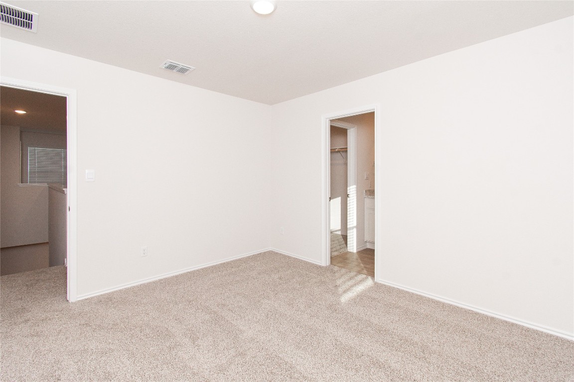 201 Varner Way Lockhart, TX 78644 - Photo 6 of 16 Unfurnished room with light colored carpet and recessed lighting