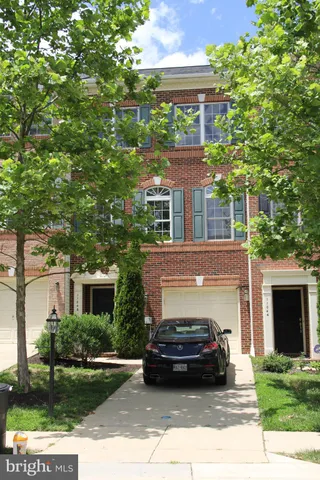 a view of a car parked in front of a house