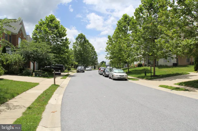 a view of street with parked cars