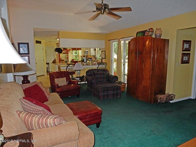 12332 Field Bluff Road Jacksonville, FL 32223 - Photo 15 of 32 FAMILY ROOM TO KITCHEN