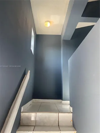 a view of bedroom and furniture