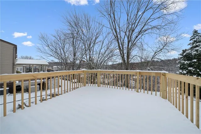 a view of a house with a bench