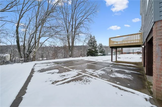 a view of street with snow on the road