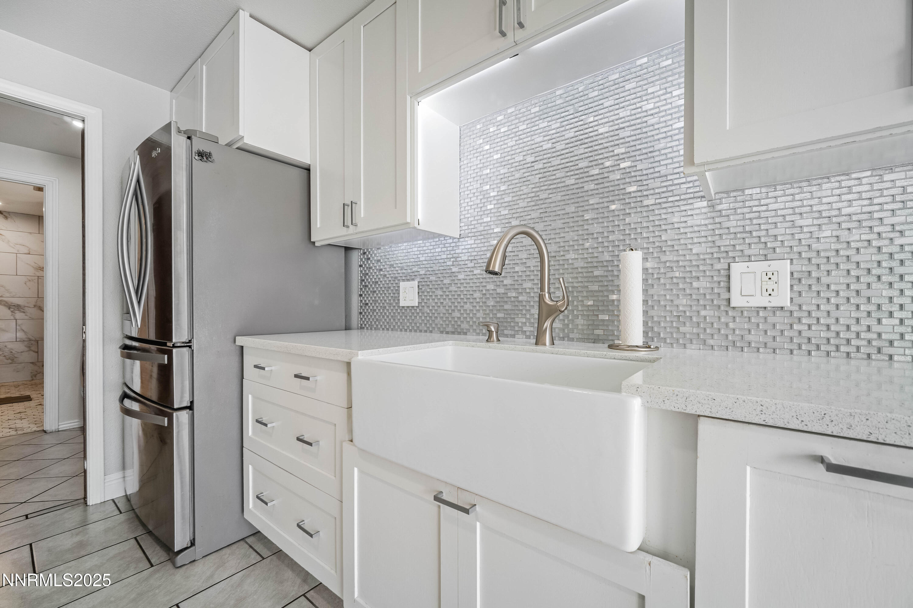 2154 Oppio Street Sparks, NV 89431 - Photo 11 of 21 a kitchen with white cabinets and refrigerator