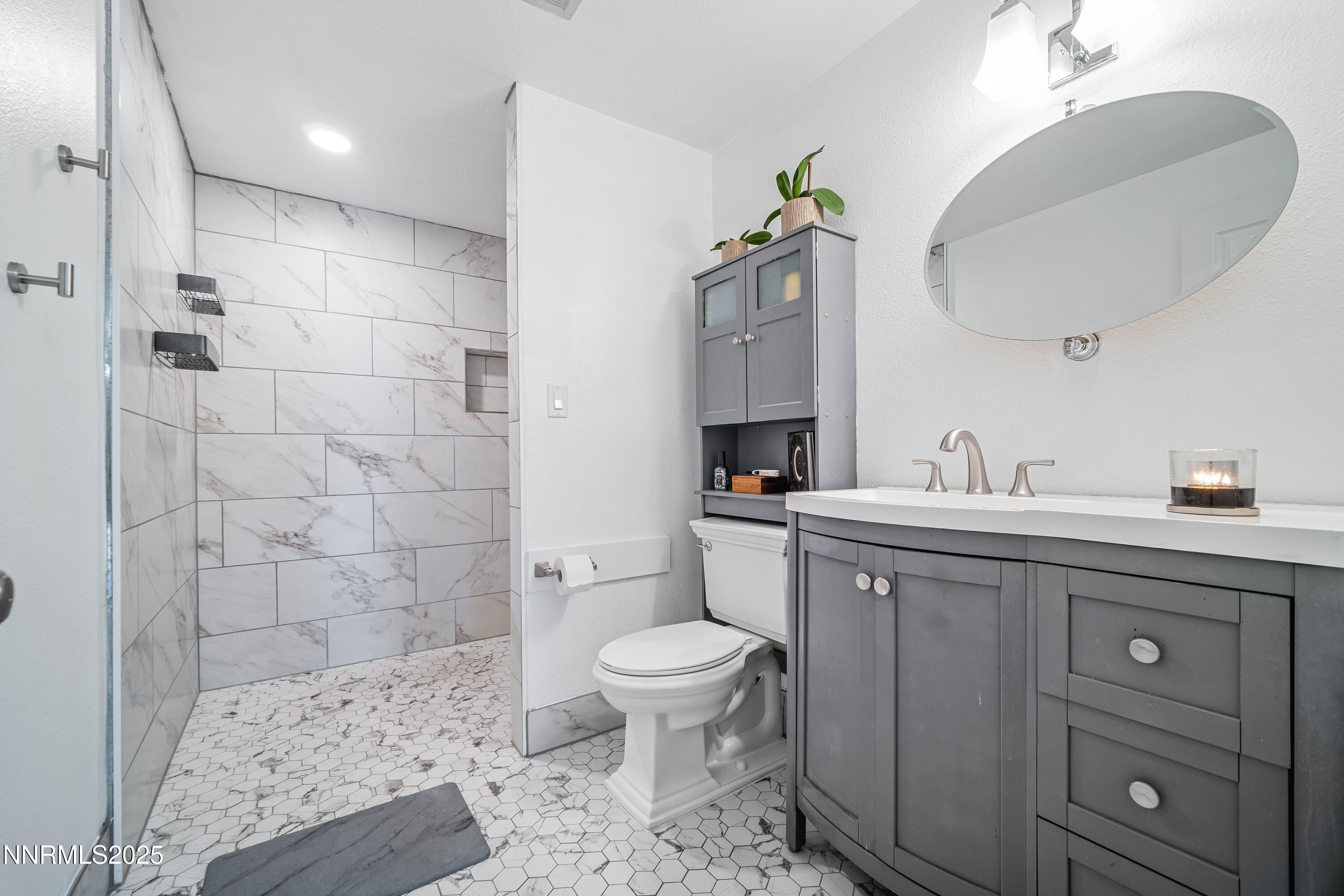 2154 Oppio Street Sparks, NV 89431 - Photo 14 of 21 a bathroom with a sink a toilet and shower