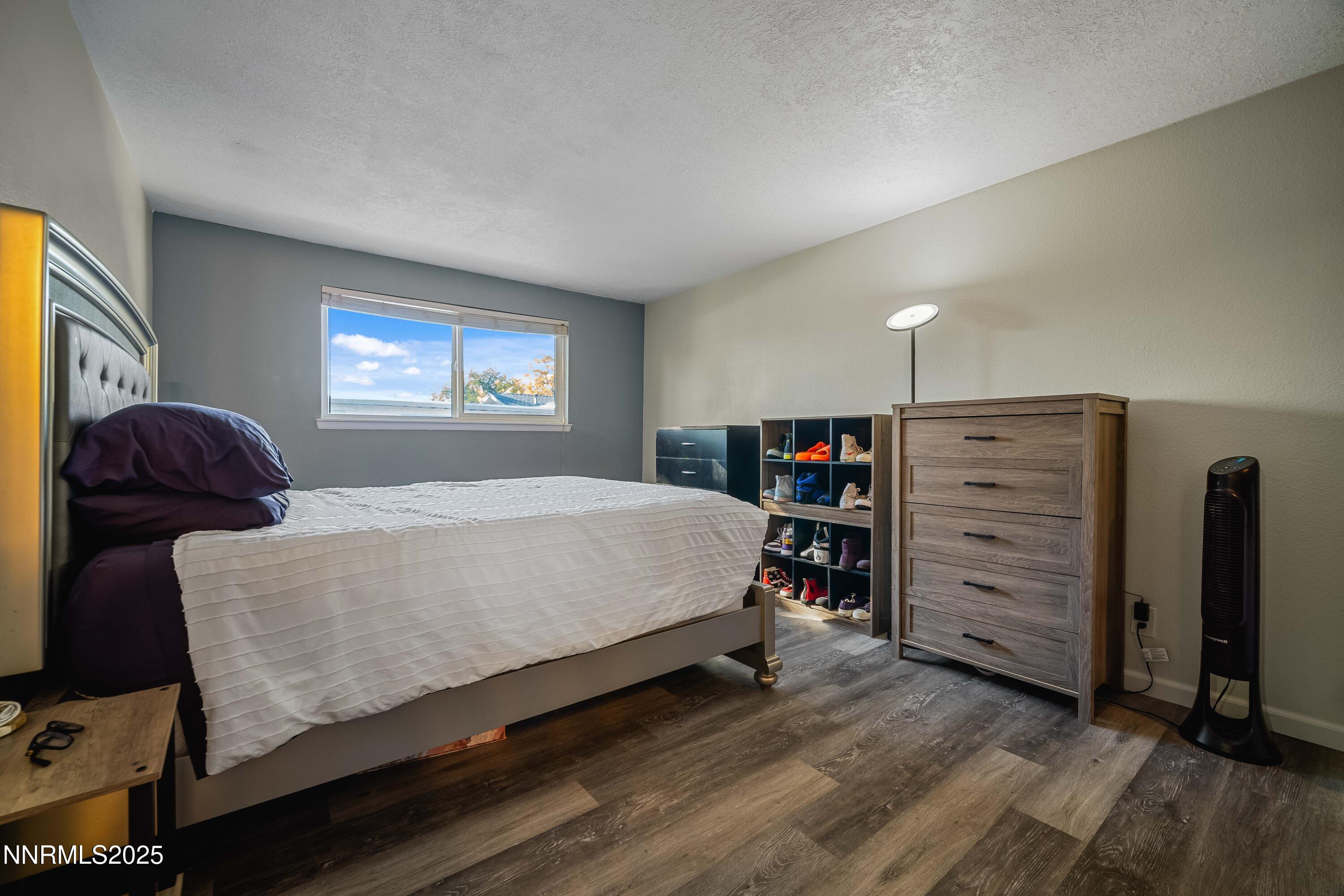 2154 Oppio Street Sparks, NV 89431 - Photo 16 of 21 a bedroom with a bed and furniture