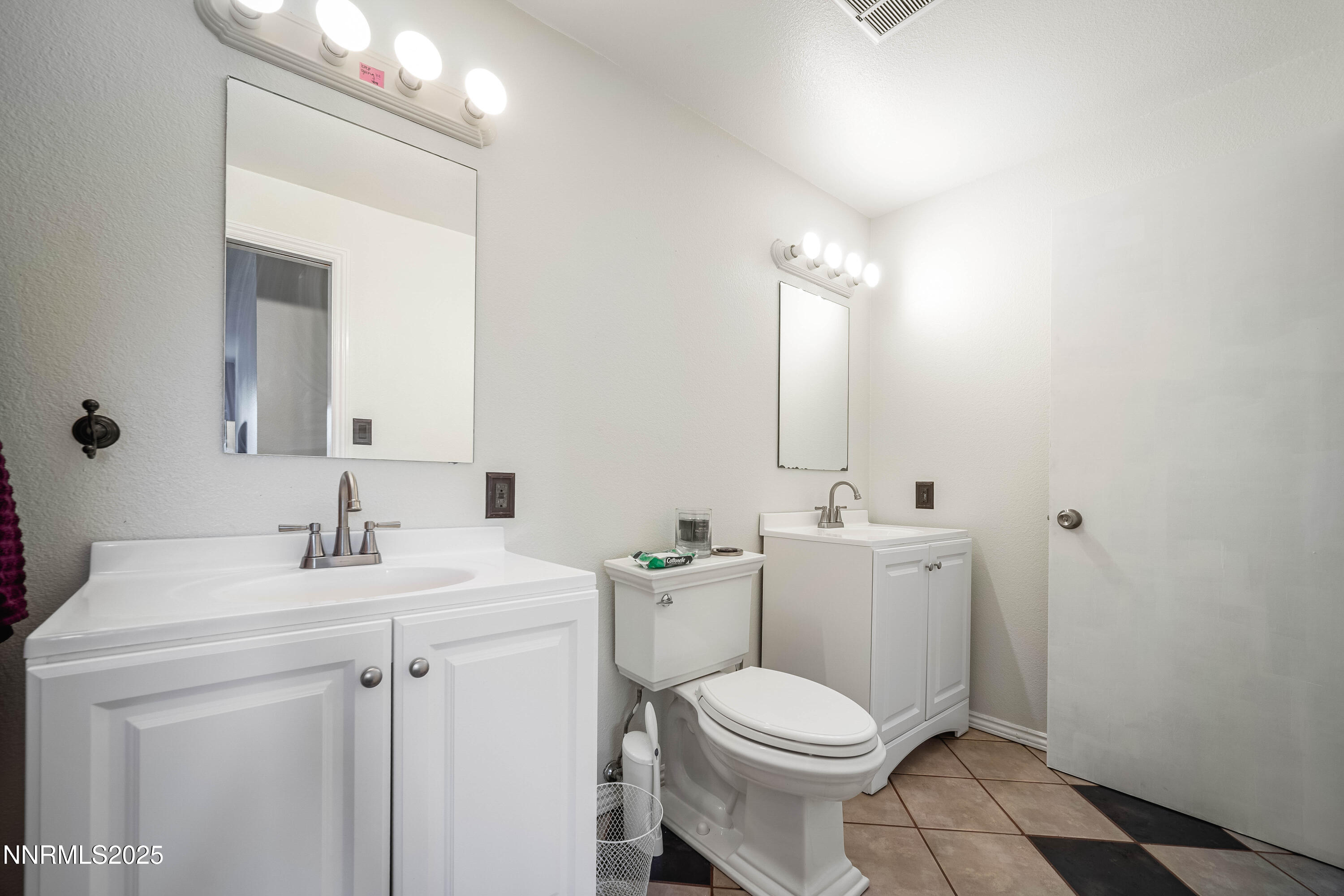 2154 Oppio Street Sparks, NV 89431 - Photo 19 of 21 a bathroom with a toilet sink and mirror