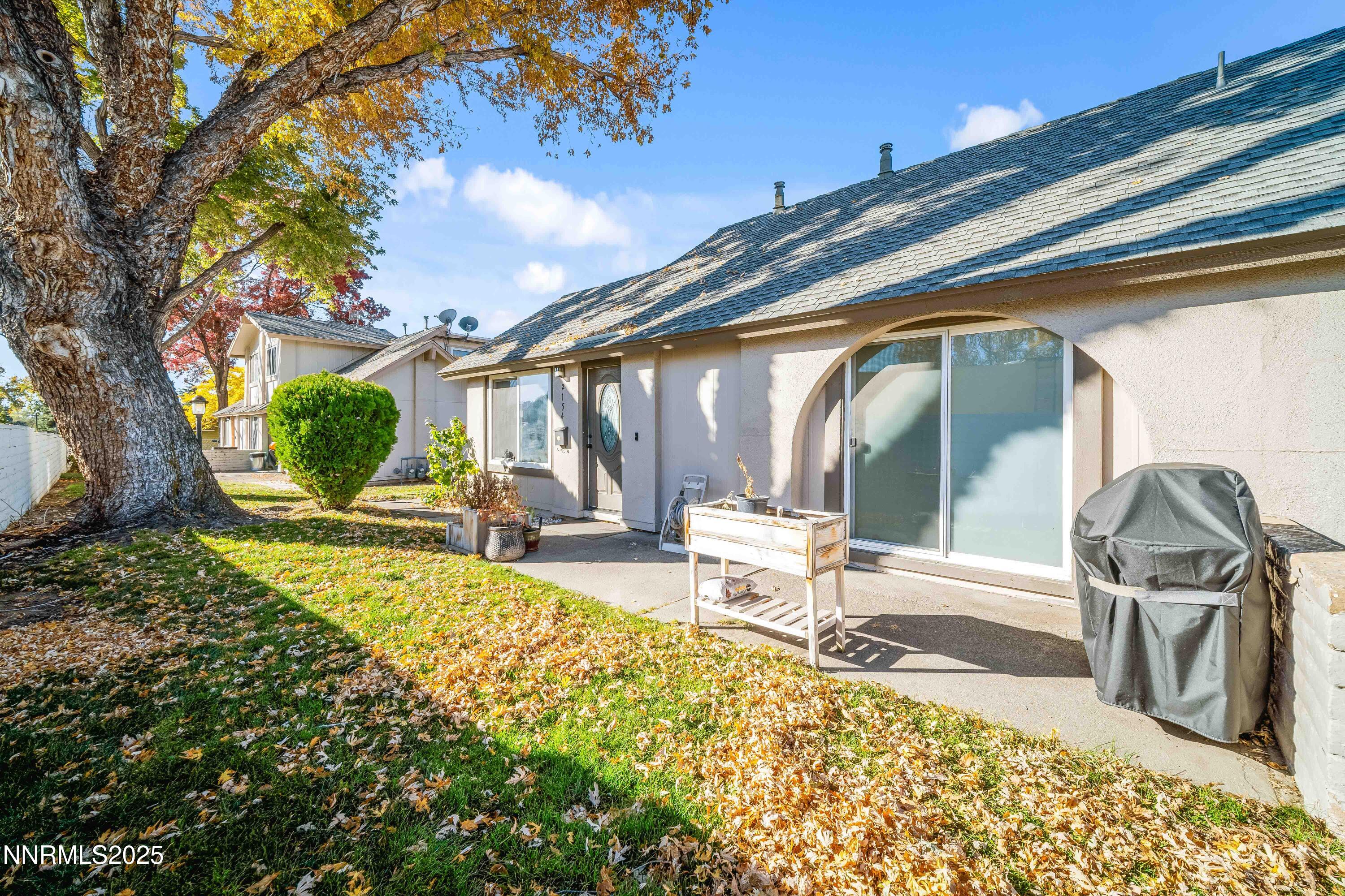 2154 Oppio Street Sparks, NV 89431 - Photo 2 of 21 a backyard of a house with table and chairs