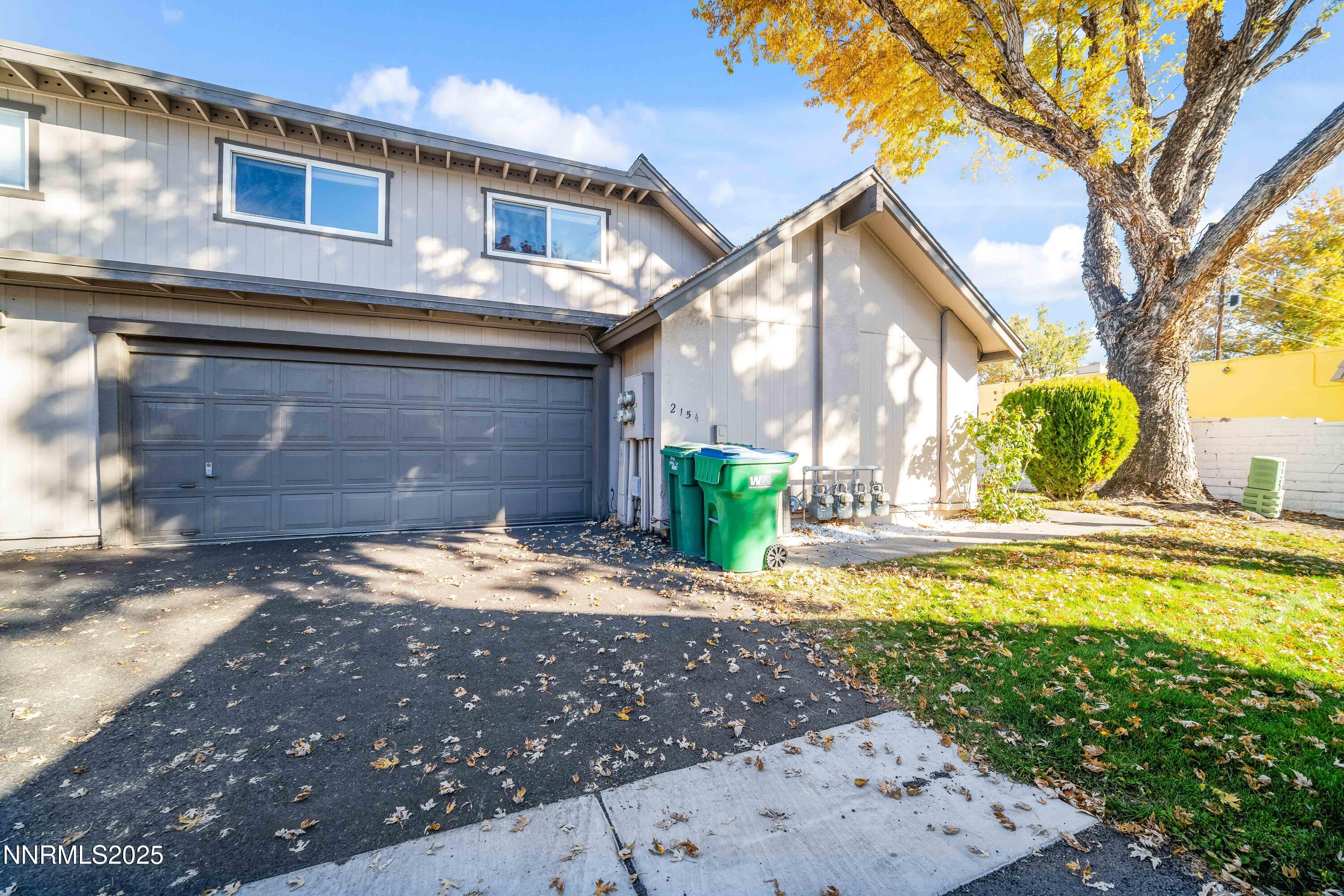 2154 Oppio Street Sparks, NV 89431 - Photo 3 of 21 a view of a house with a yard