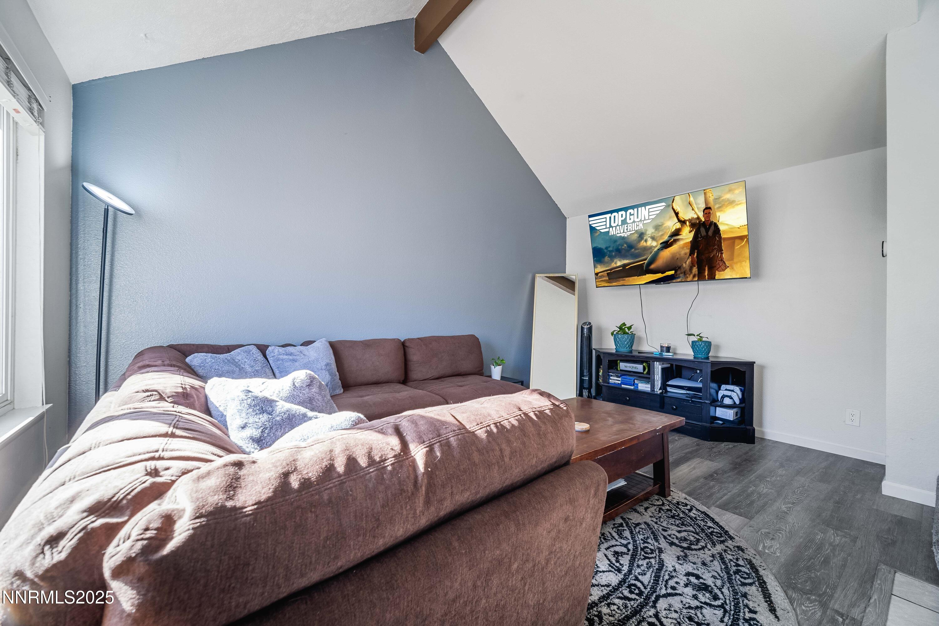2154 Oppio Street Sparks, NV 89431 - Photo 4 of 21 a bedroom with a bed and a couch