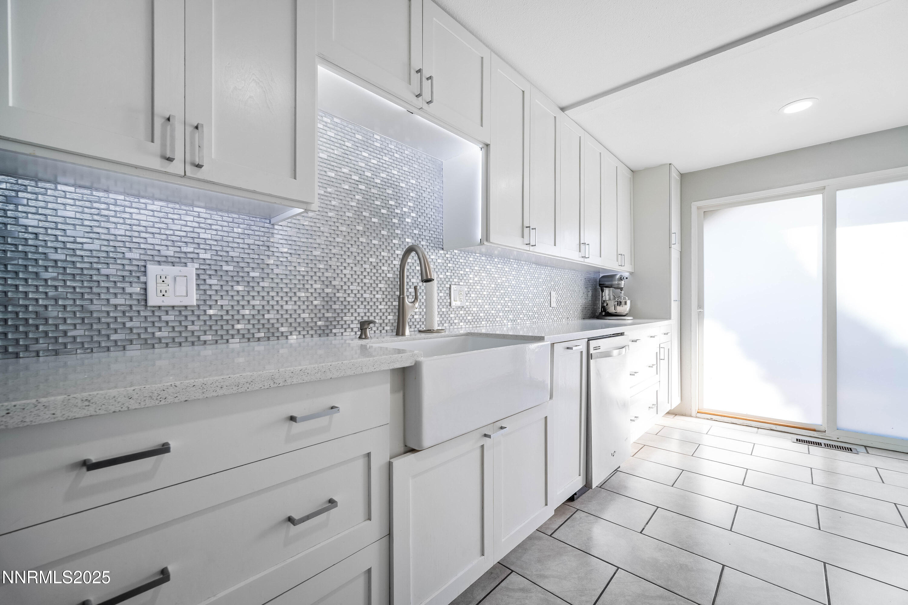 2154 Oppio Street Sparks, NV 89431 - Photo 10 of 21 a kitchen with granite countertop a sink and a stove