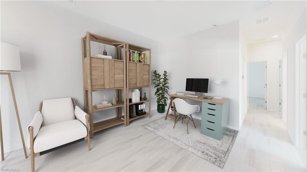 3114 Juniper Way Naples, FL 34112 - Photo 23 of 28 a living room with furniture and a flat screen tv