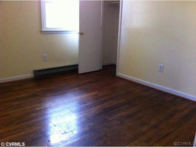 15700 Saddlebrook Road Chesterfield, VA 23838 - Photo 4 of 6 an empty room with wooden floor and windows