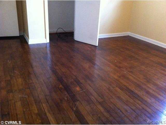 15700 Saddlebrook Road Chesterfield, VA 23838 - Photo 5 of 6 a view of an empty room with wooden floor and a window