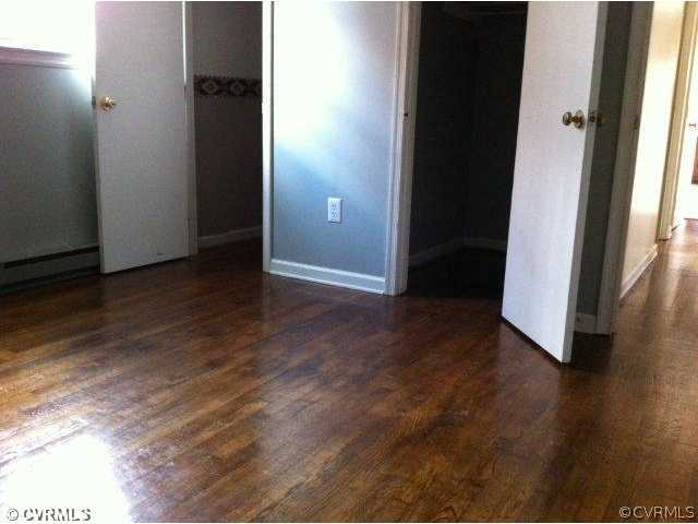 15700 Saddlebrook Road Chesterfield, VA 23838 - Photo 6 of 6 an empty room with wooden floor and entrance
