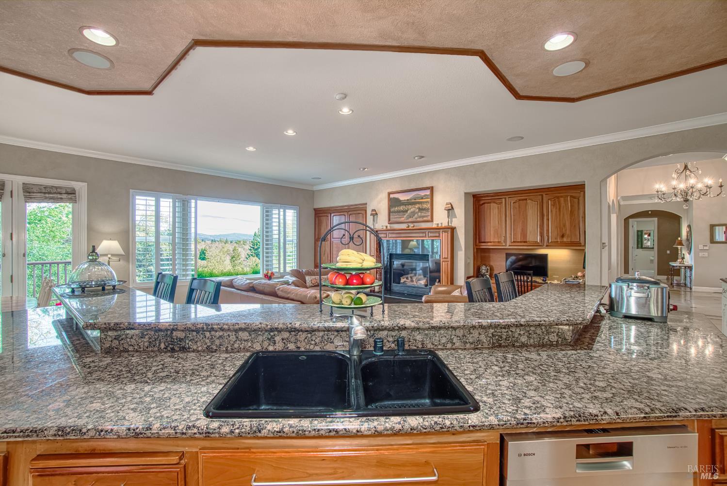2703 Brush Creek Road Santa Rosa, CA 95404 - Photo 37 of 78 a kitchen with granite countertop kitchen island granite countertop a sink cabinets and window