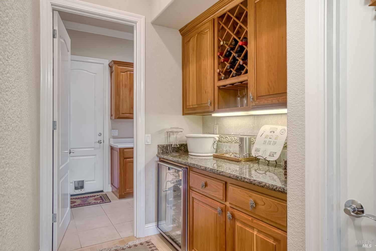 2703 Brush Creek Road Santa Rosa, CA 95404 - Photo 46 of 78 a bathroom with a granite countertop sink and a mirror