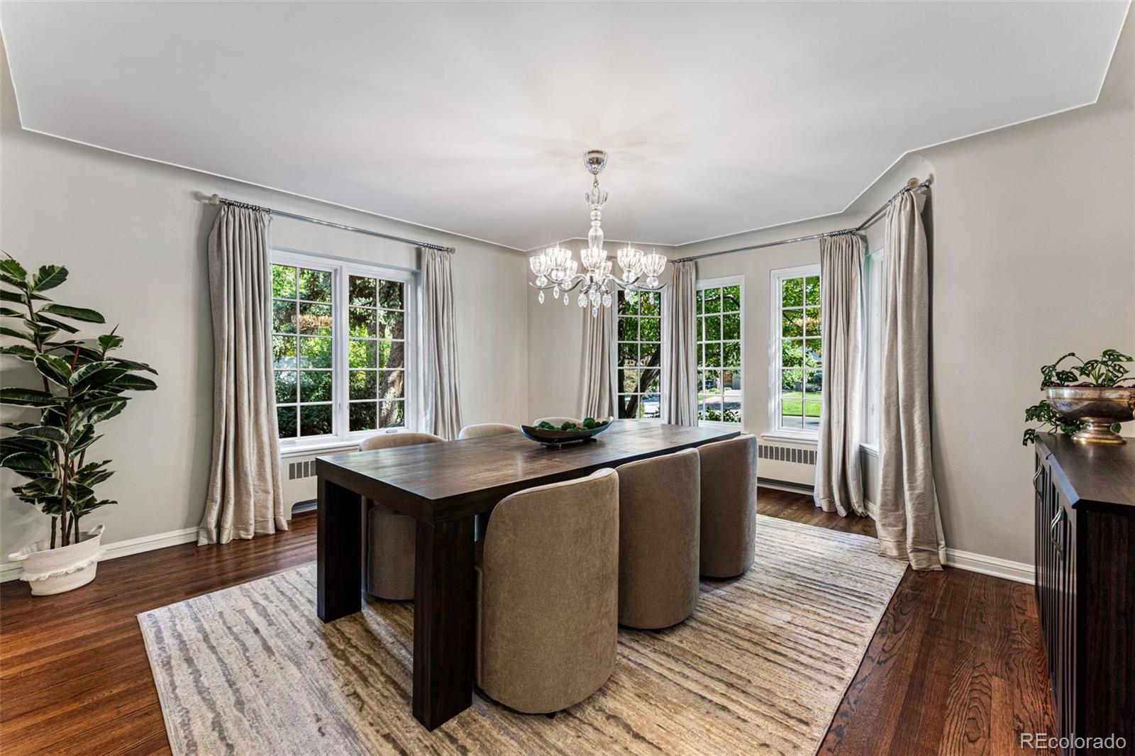 28 Crestmoor Drive Denver, CO 80220 - Photo 12 of 45 a kitchen with stainless steel appliances granite countertop a stove and a wooden floors