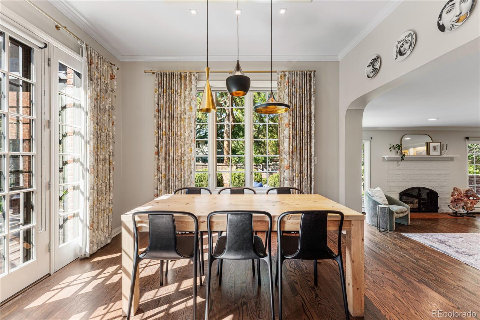 28 Crestmoor Drive Denver, CO 80220 - Photo 19 of 45 a view of a dining room with furniture and chandelier