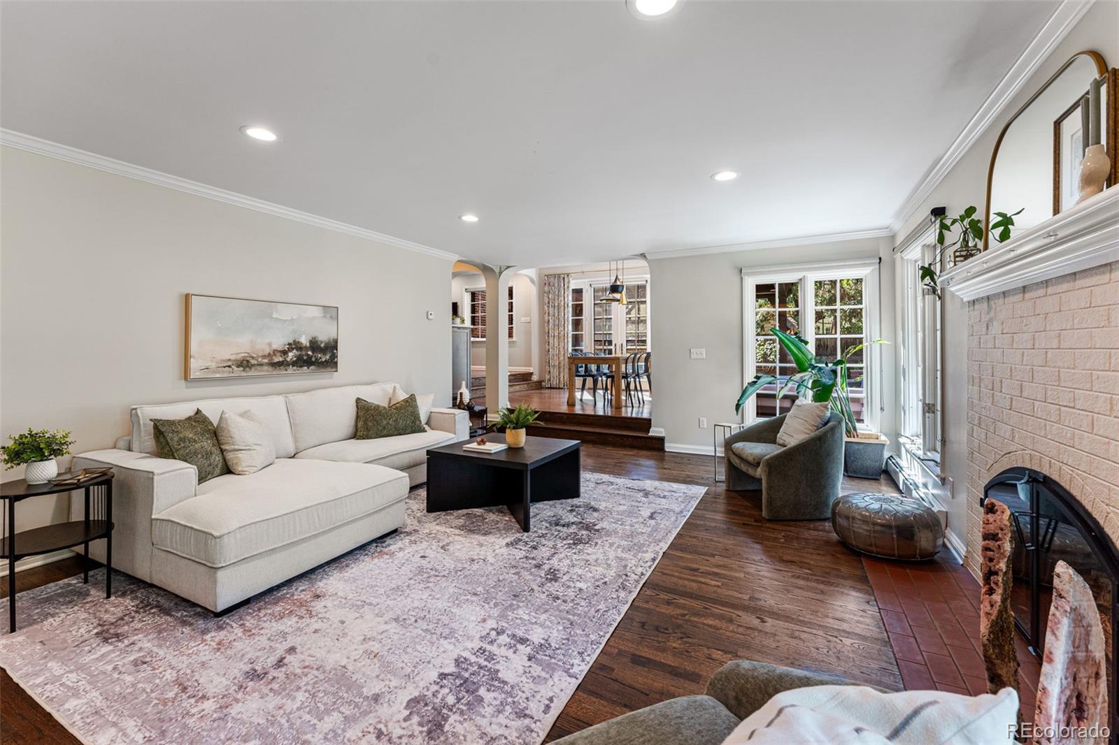 28 Crestmoor Drive Denver, CO 80220 - Photo 23 of 45 a living room with furniture and a couch