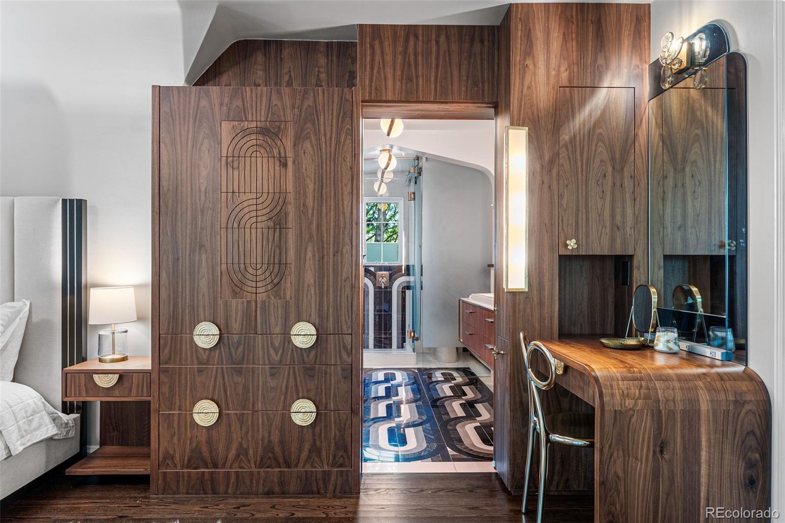 28 Crestmoor Drive Denver, CO 80220 - Photo 26 of 45 a bedroom with a bed and a mirror