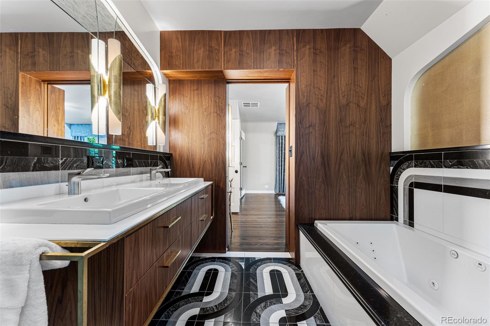 28 Crestmoor Drive Denver, CO 80220 - Photo 28 of 45 a bathroom with a sink a mirror and a bathtub
