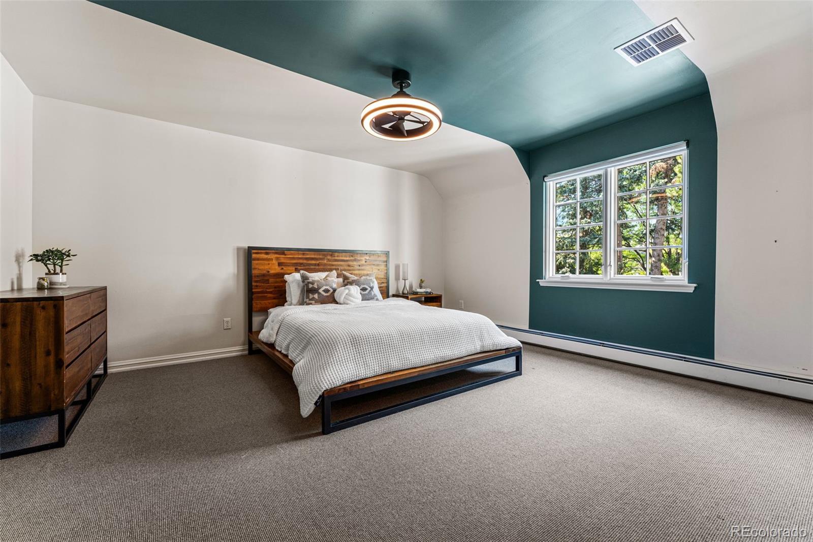 28 Crestmoor Drive Denver, CO 80220 - Photo 30 of 45 a bedroom with a bed and a window