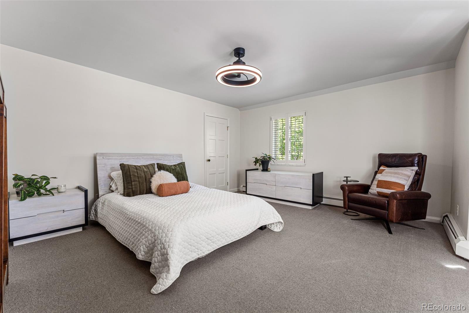 28 Crestmoor Drive Denver, CO 80220 - Photo 31 of 45 a bedroom with bed and a window