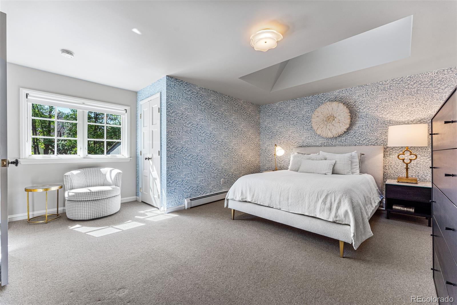 28 Crestmoor Drive Denver, CO 80220 - Photo 35 of 45 a bedroom with a bed and window