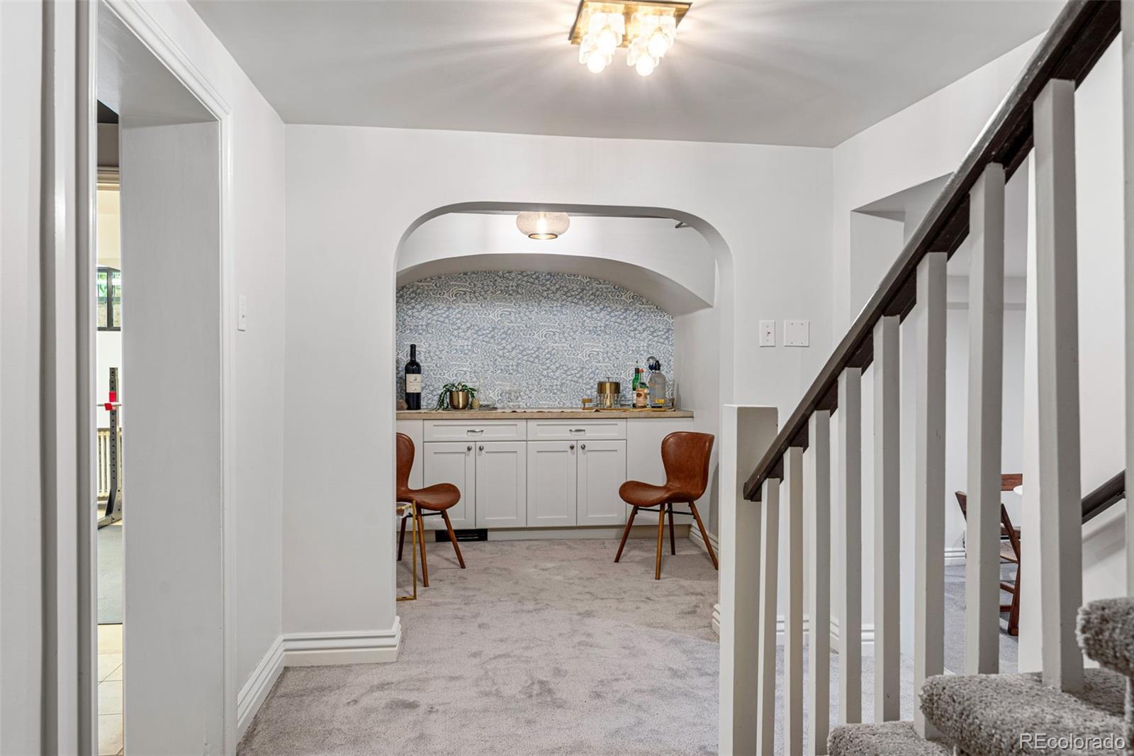 28 Crestmoor Drive Denver, CO 80220 - Photo 37 of 45 a view of livingroom with furniture and stairs