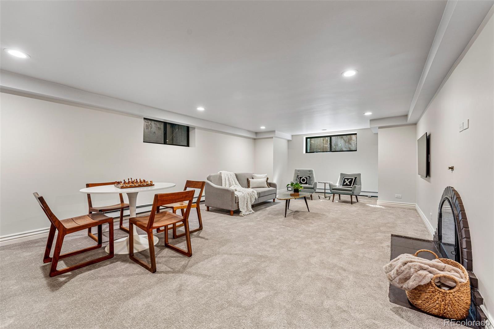 28 Crestmoor Drive Denver, CO 80220 - Photo 38 of 45 a living room with furniture and a gym equipment