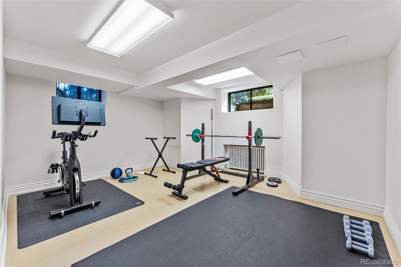 28 Crestmoor Drive Denver, CO 80220 - Photo 40 of 45 a view of a room with gym equipment