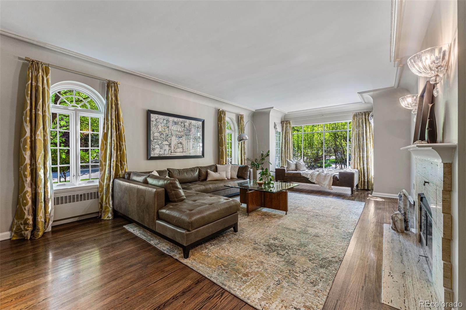 28 Crestmoor Drive Denver, CO 80220 - Photo 5 of 45 a living room with furniture and a large window