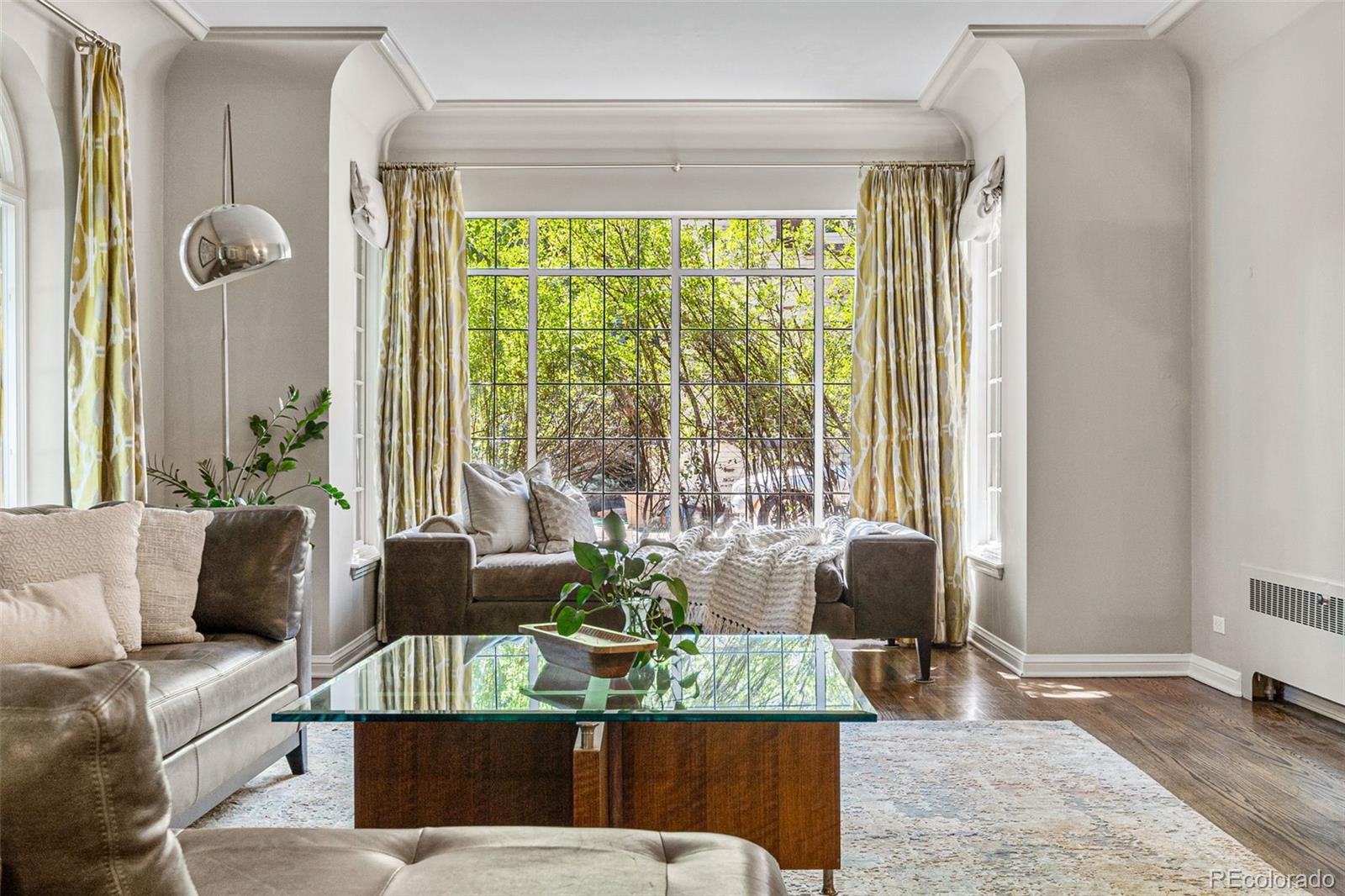 28 Crestmoor Drive Denver, CO 80220 - Photo 6 of 45 a living room with furniture and a large window