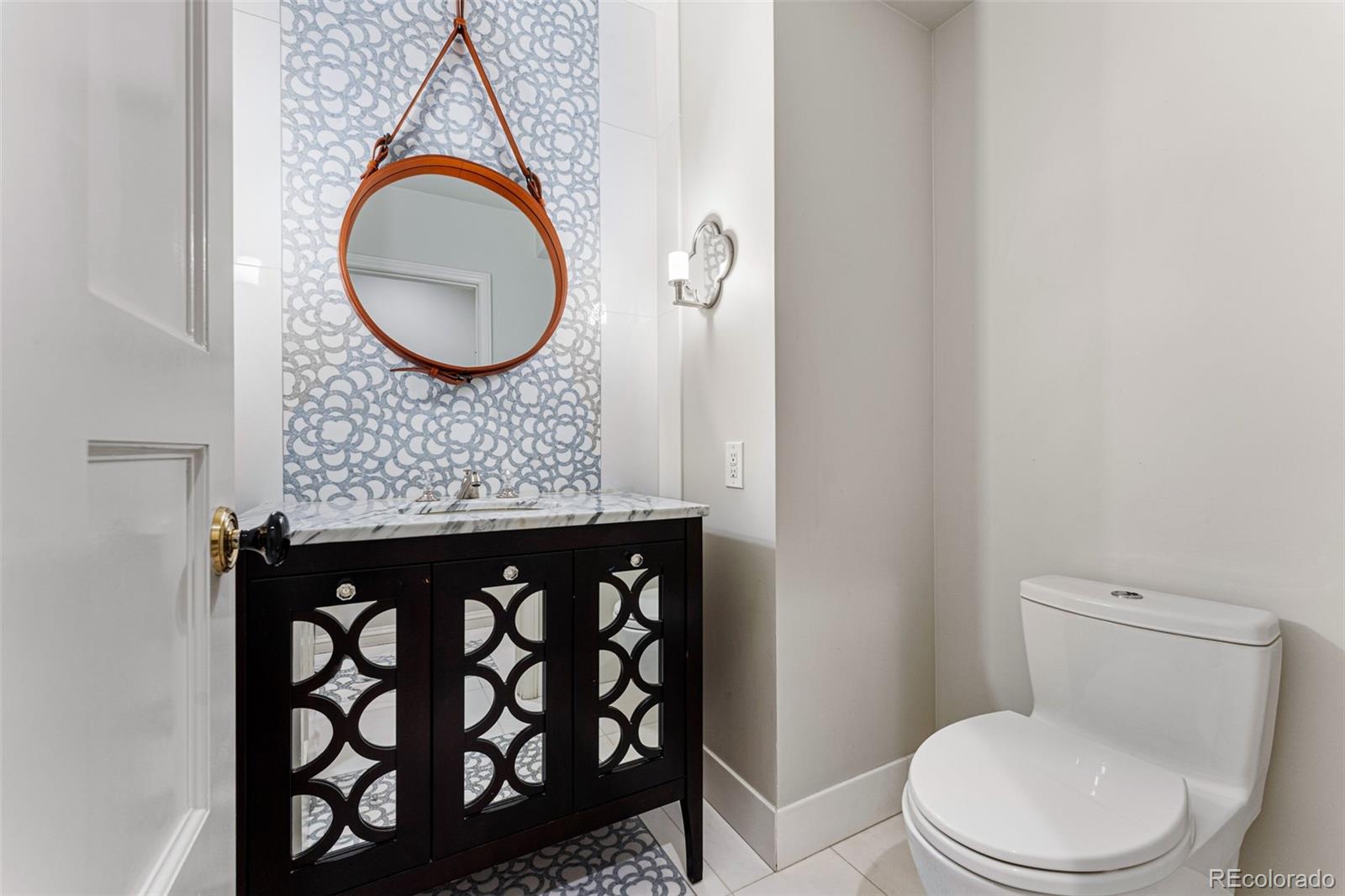 28 Crestmoor Drive Denver, CO 80220 - Photo 8 of 45 a bathroom with a granite countertop toilet sink mirror vanity and vanity