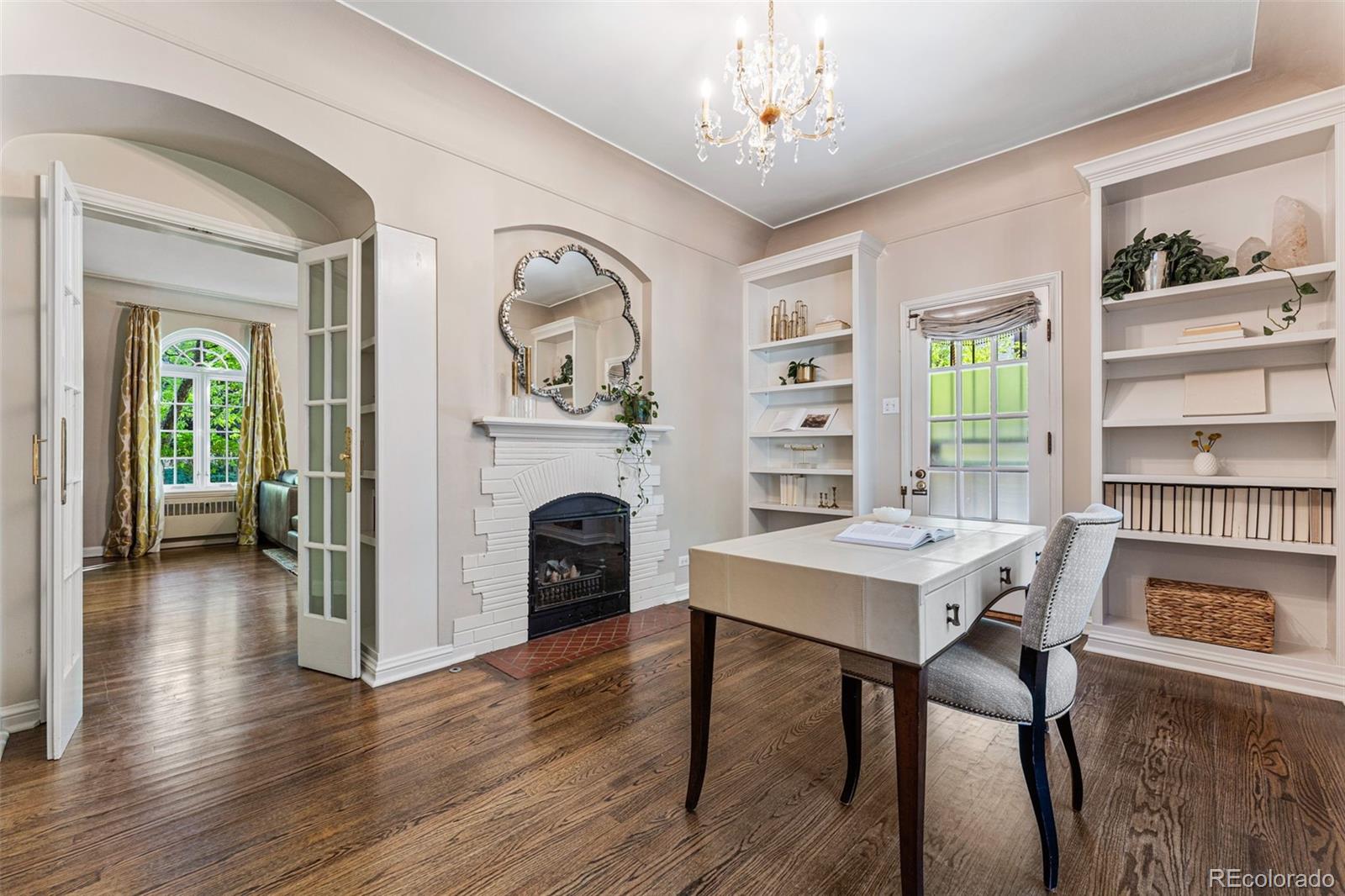28 Crestmoor Drive Denver, CO 80220 - Photo 9 of 45 a view of a dining room with furniture window and wooden floor