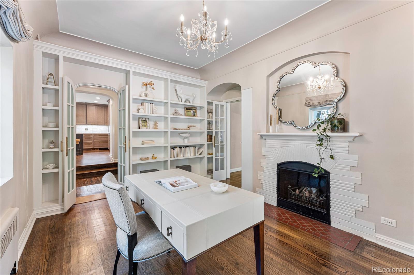 28 Crestmoor Drive Denver, CO 80220 - Photo 10 of 45 a living room with furniture and a fireplace