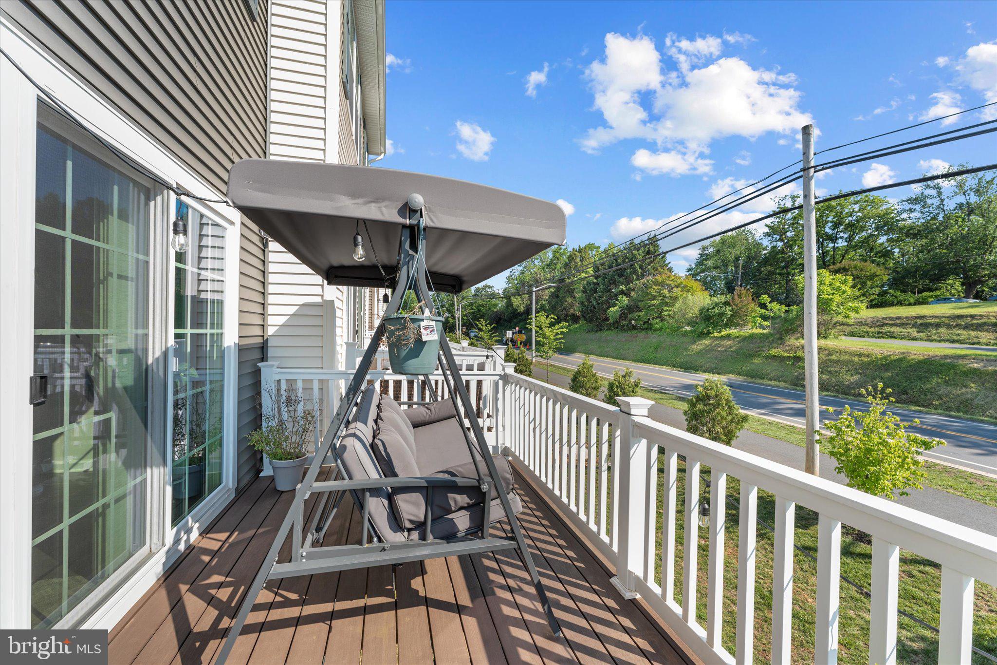 1776 Scenic Loop Culpeper, VA 22701 - Photo 16 of 36 a view of a chair and tables in the balcony
