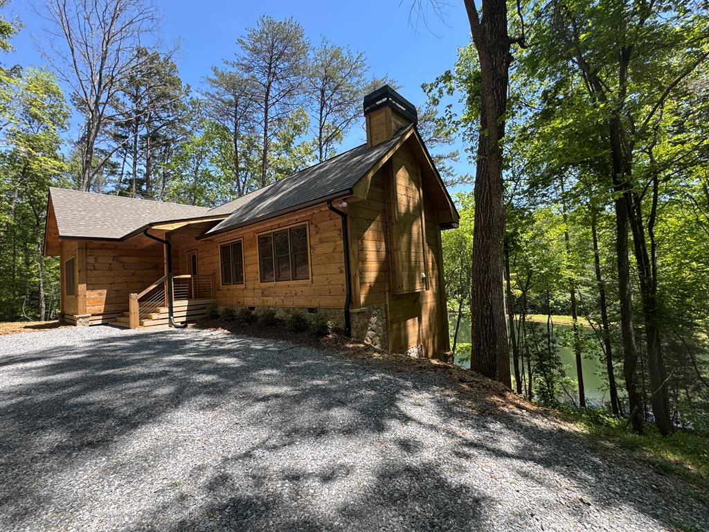 85 Moreland Trail Blue Ridge, GA 30513 - Photo 36 of 56 a view of a house with a yard and large tree