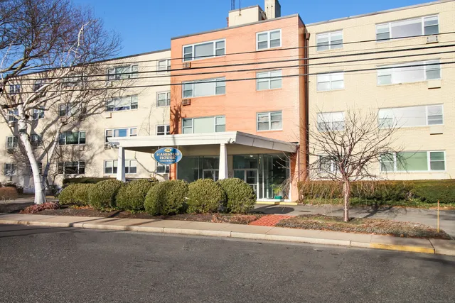 a front view of a building with a street