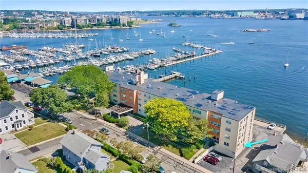 an aerial view of a house with a lake view