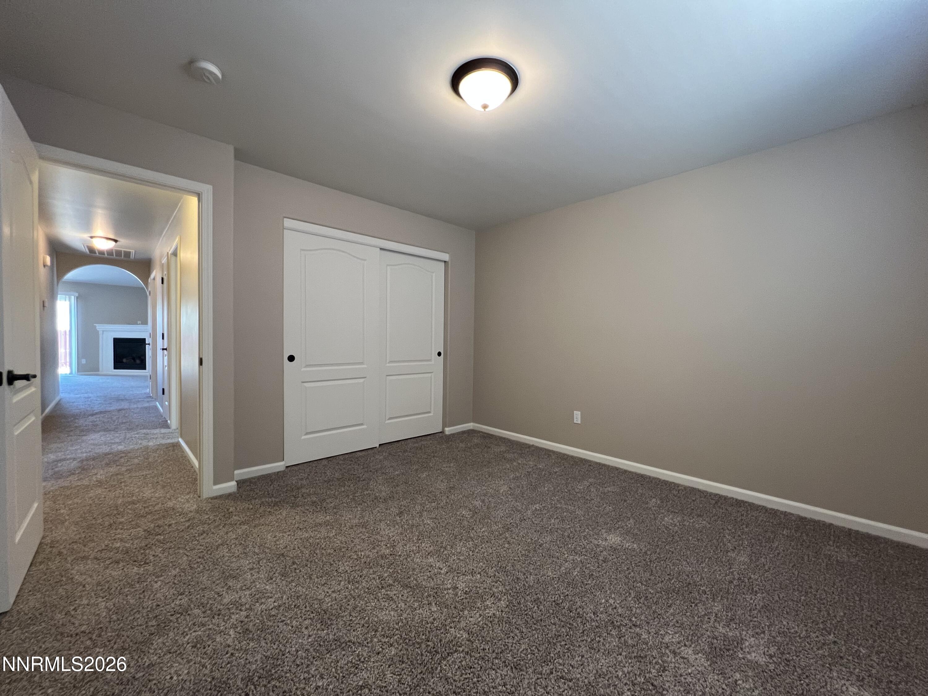 18406 Teddy Bear Court Reno, NV 89508 - Photo 25 of 44 an empty room with closet and mirror view