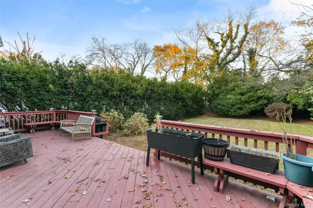 a view of a chairs and table on the wooden deck
