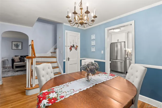 a bedroom with furniture and a chandelier